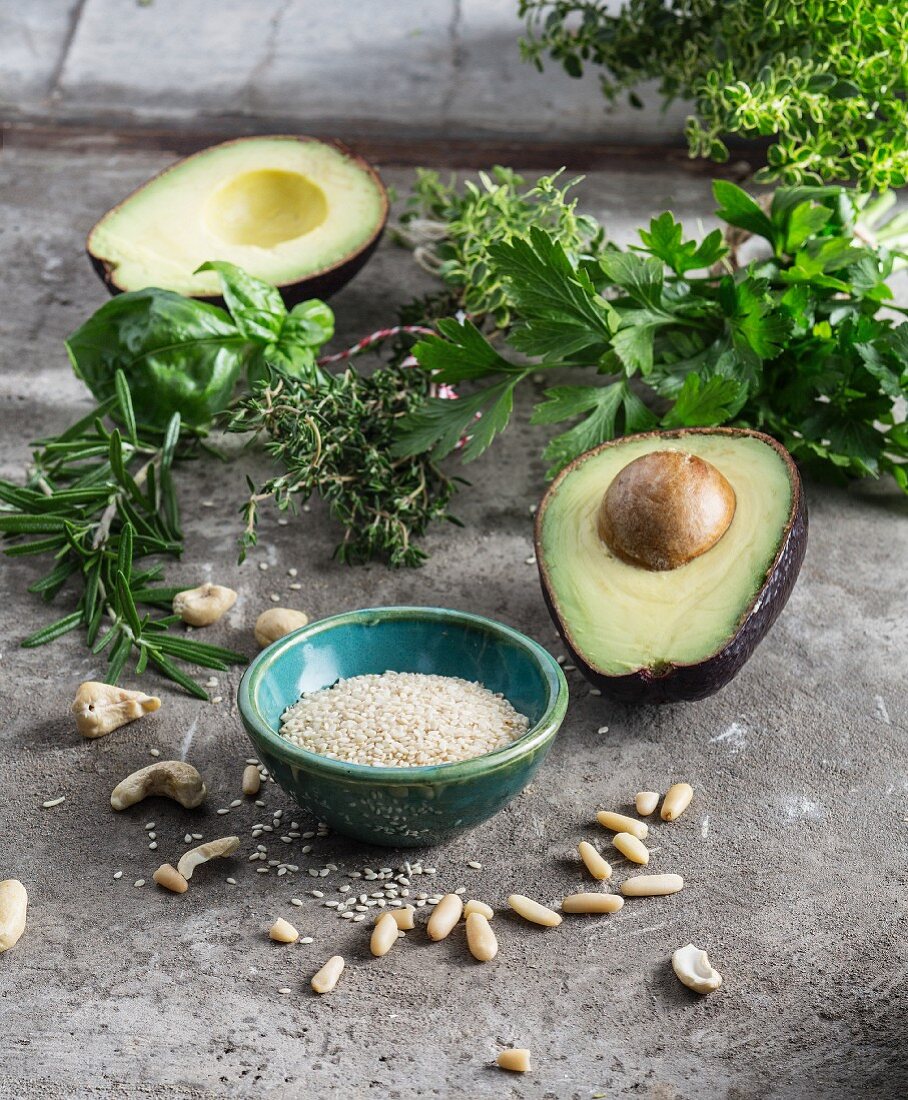 Fresh herbs, avocado, sesame seeds and pine nuts