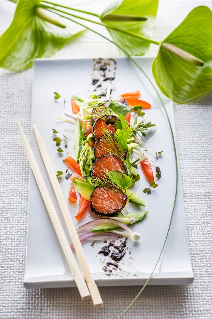 Salmon wrapped in nori with herbs and vegetables