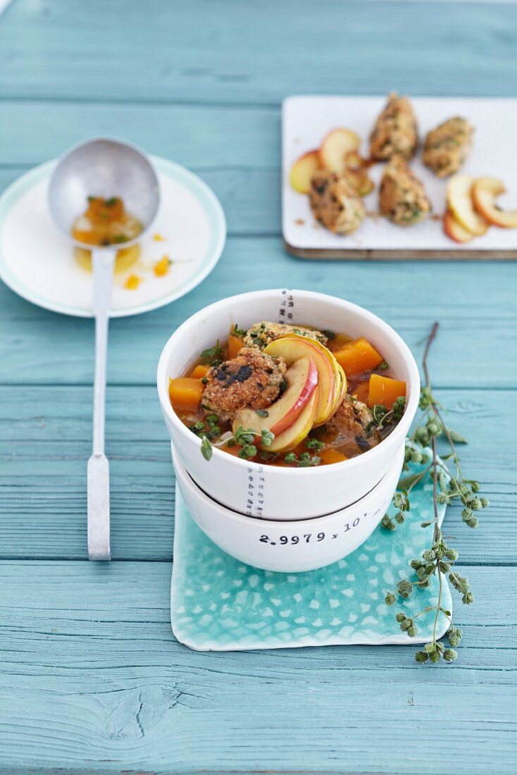 Pumpkin stew with amaranth dumplings and fried apple slices