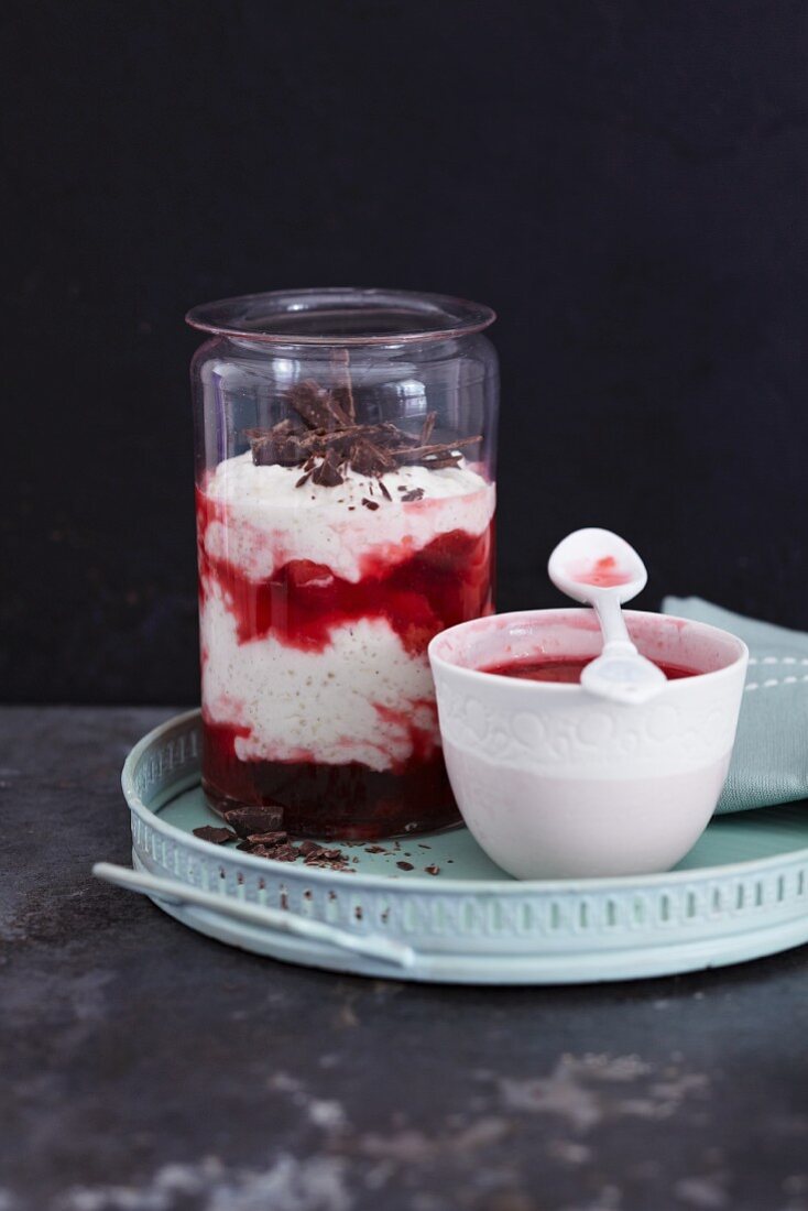 A cream and quinoa layered dessert with plum compote
