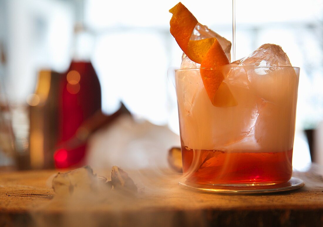 Negroni with dry ice in a bar