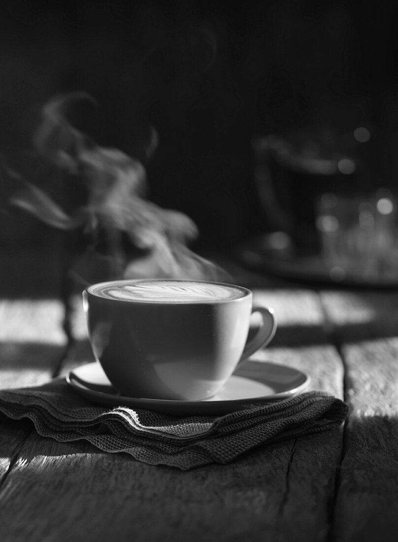 A cup of steaming cappuccino