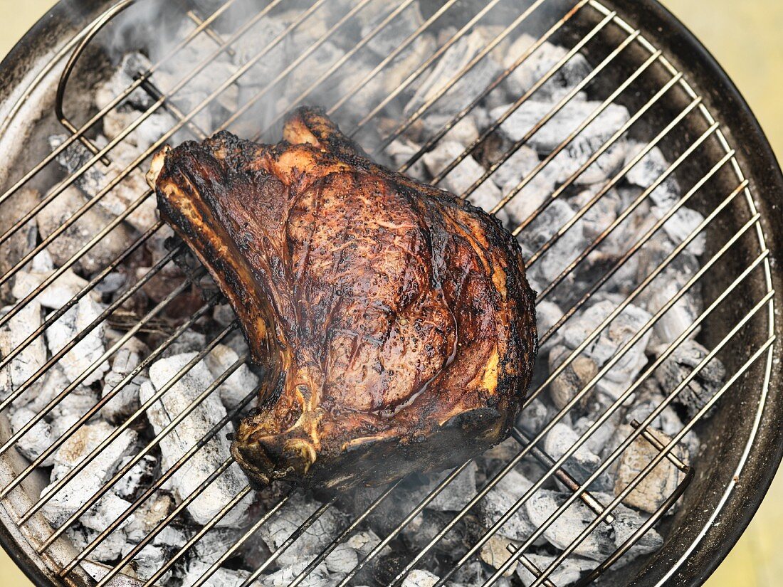 Beef steak on a barbecue (seen from above)