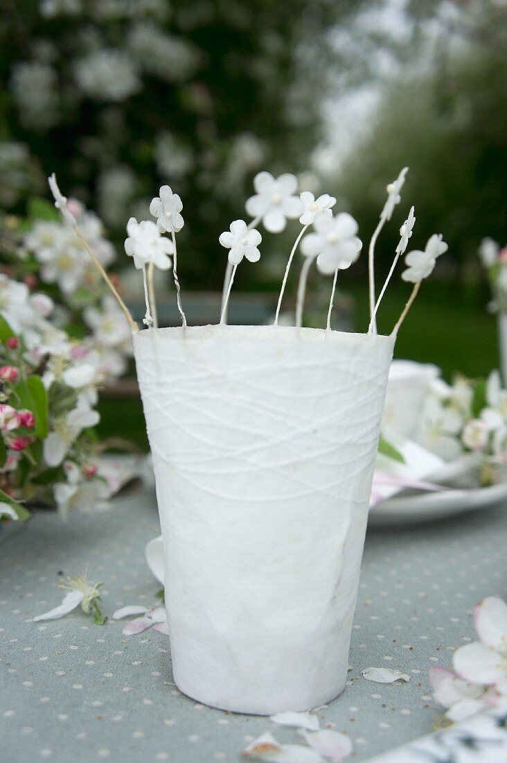 Apple blossom in paper cups