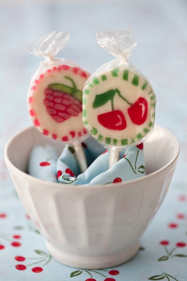 Cherry lollies in a bowl with a napkin