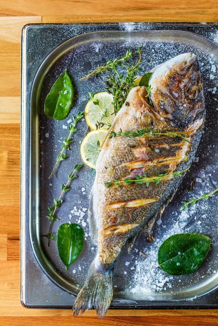 Oven-baked seabream with herbs and lemon