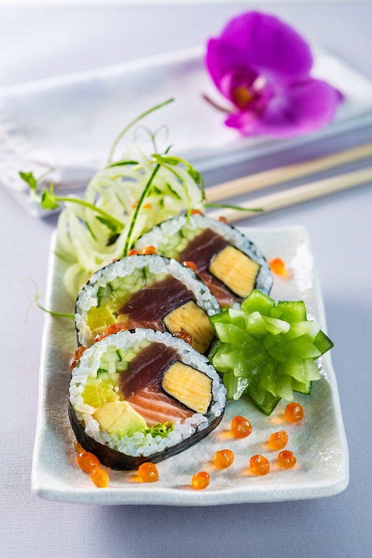 Futomaki sushi with omelette, tuna, salmon, avocado and cucumber