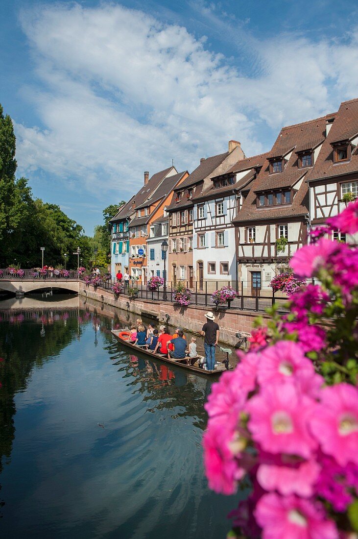 Sailing over the loch in a ferry past half-timbered houses, Colmar