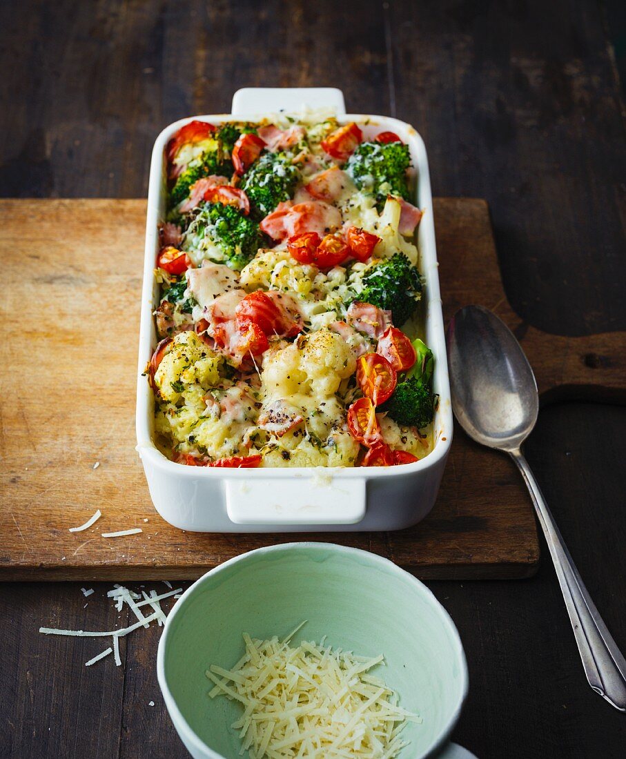 Cauliflower and broccoli bake with cherry tomatoes and lean ham