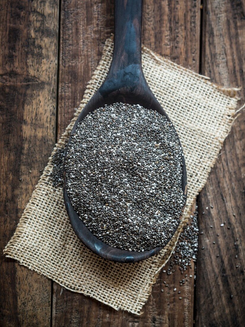 Chia seeds on a wooden spoon