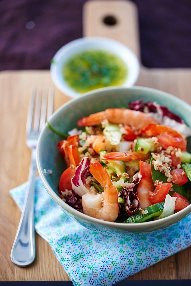 Prawn salad with quinoa, cucumber, tomatoes and radicchio