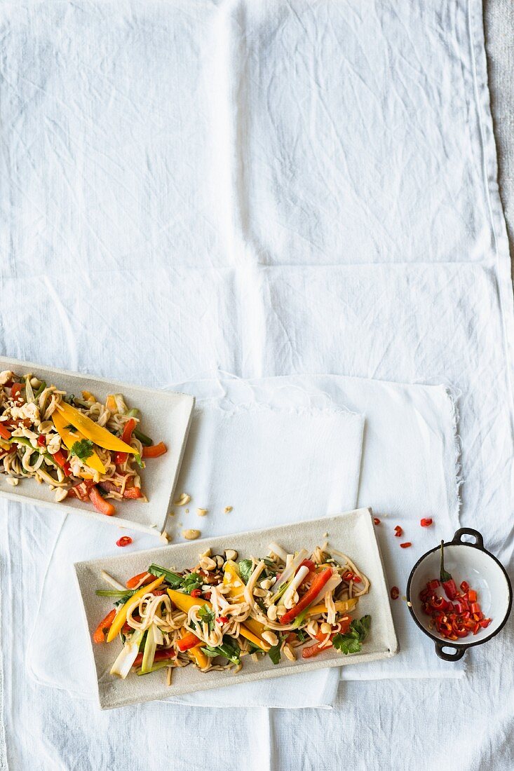 Rice noodle salad with colourful peppers, mango and tamari