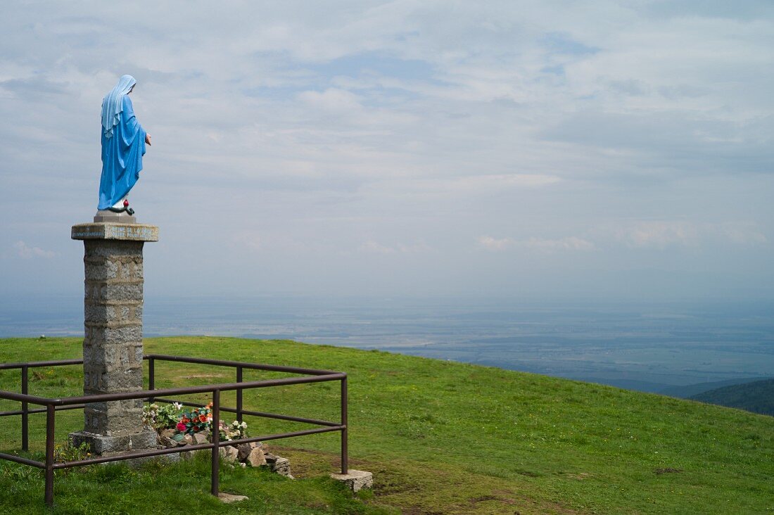 A statue of the Virgin Mary and a wonderful view of the Alsace Rhine plain on Le Petit Ballon