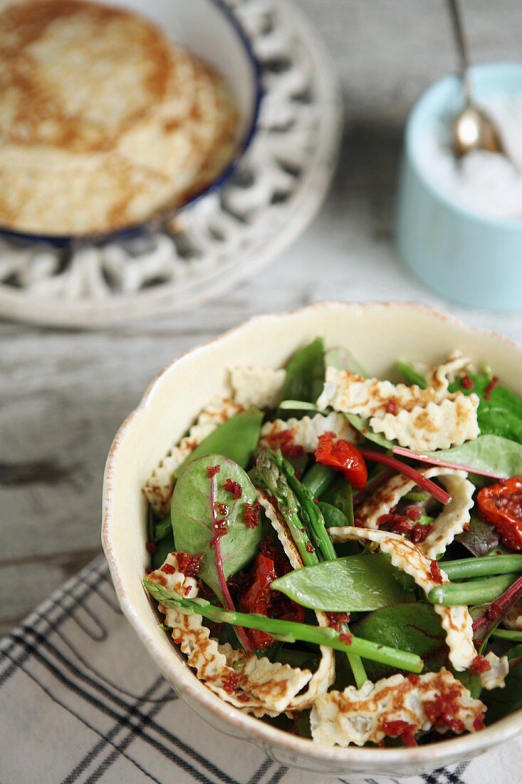 Asparagus salad with mange tout, green beans and pancake strips