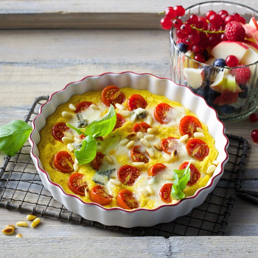 Onion and polenta quiche with cherry tomatoes and Gorgonzola
