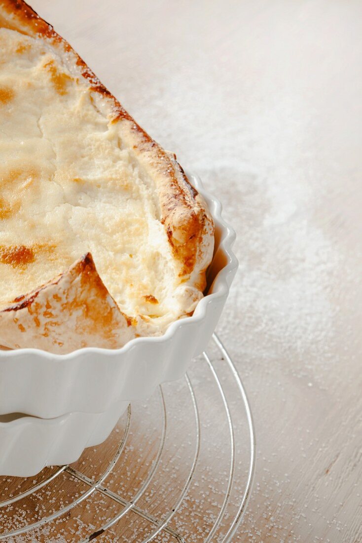 Puff pasty cheese cake in a baking dish (detail)