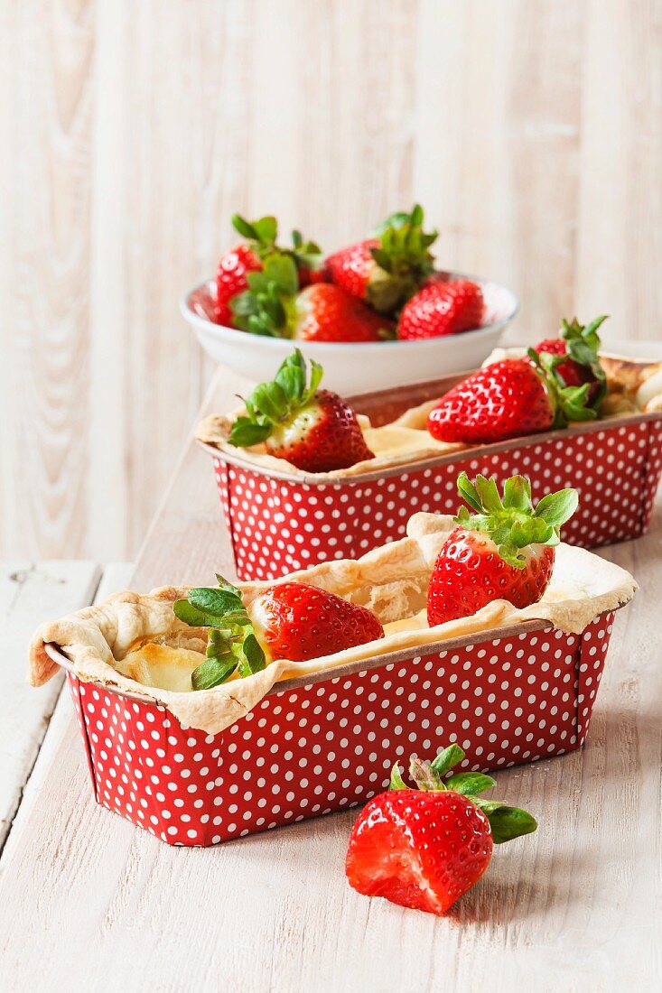 Mini strawberry and quark ckaes in polka dot baking tins