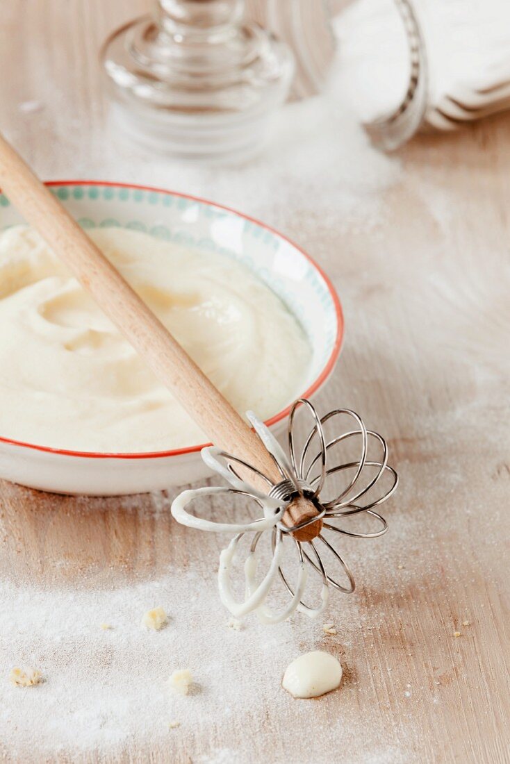 Quark for cheesecake with a whisk and sugar