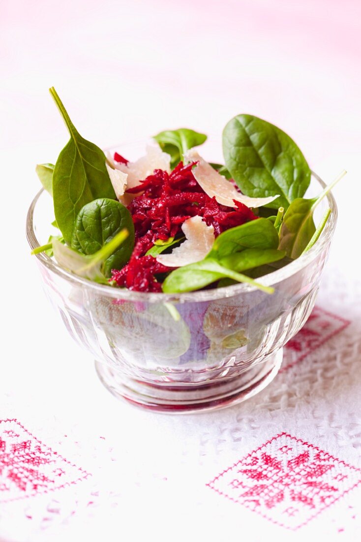 A spring salad with grated beetroot and Parmesan cheese