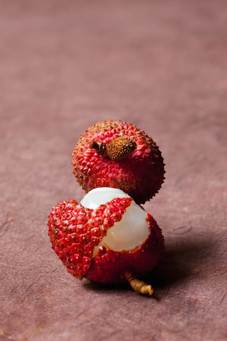 Two lychees, one opened