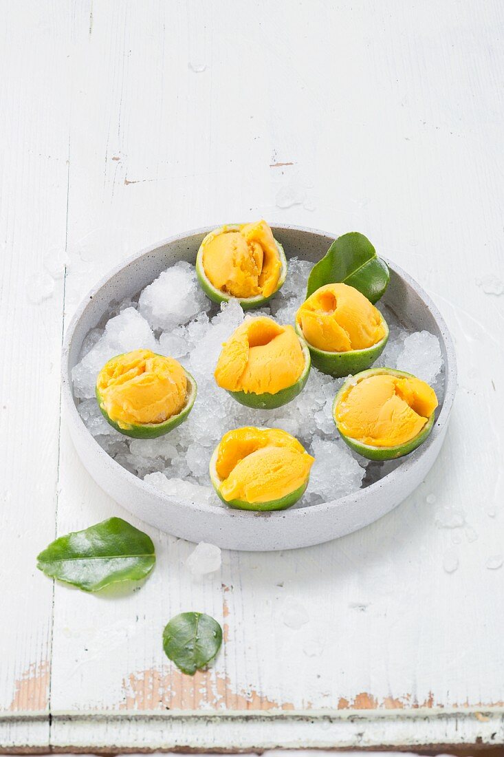 Mango sorbet served in iced limes
