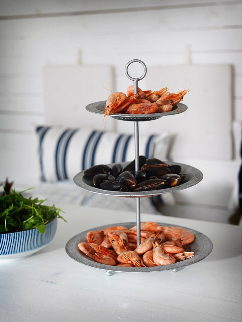 Seafood on cake stand in maritime interior