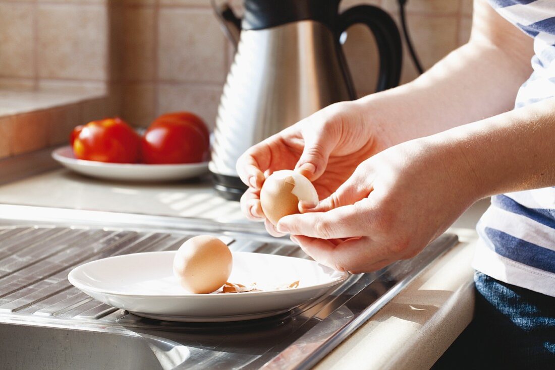 Hard-boiled eggs being shelled