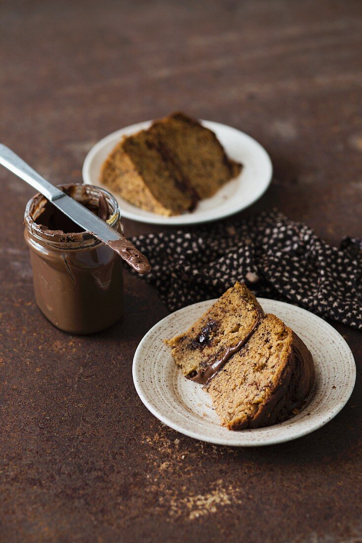 Two slices of banana cake with chocolate spread