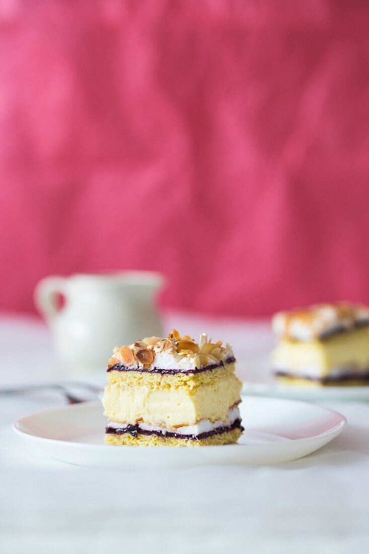 A slice of layer cake with an almond filling