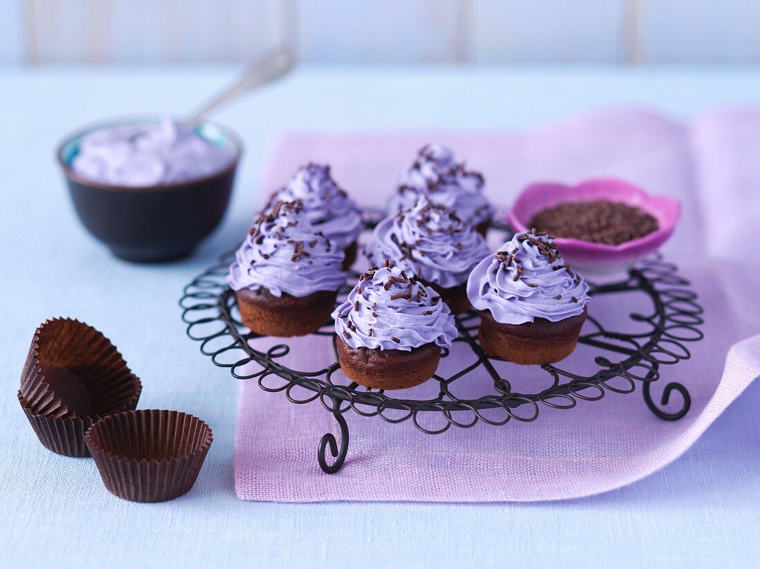 Mini chocolate cupcakes with purple buttercream