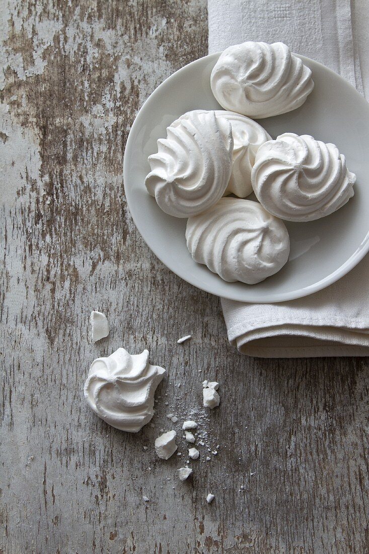 Meringues on a plate and next to it