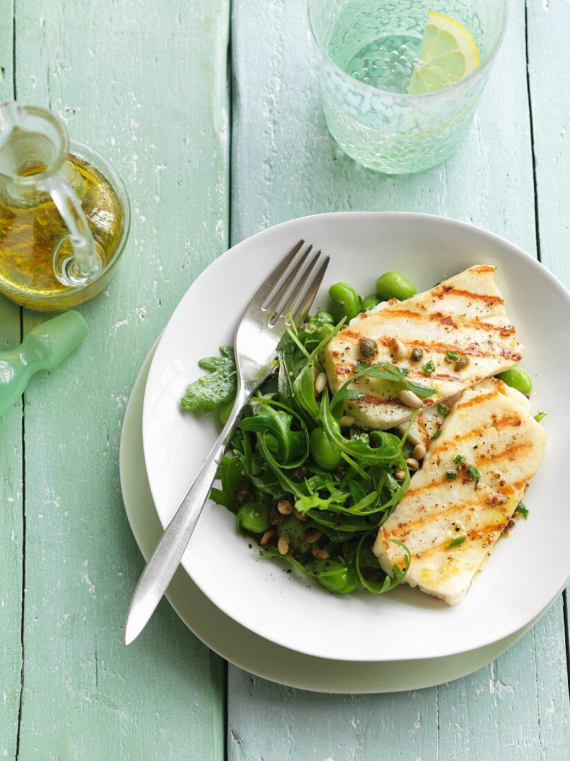 Grilled halloumi with rocket, edamame, capers and pine nuts