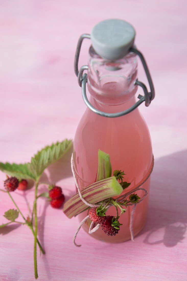 A bottle of wild strawberry and rhubarb syrup