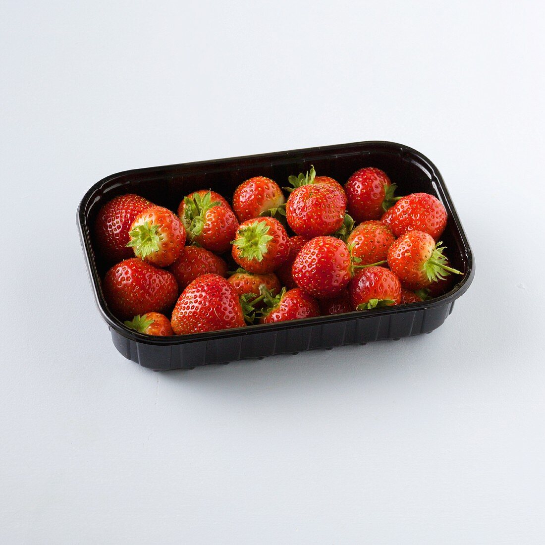 Strawberries in plastic punnet