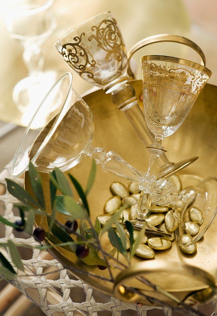 Elegant crystal glasses in silver bowl