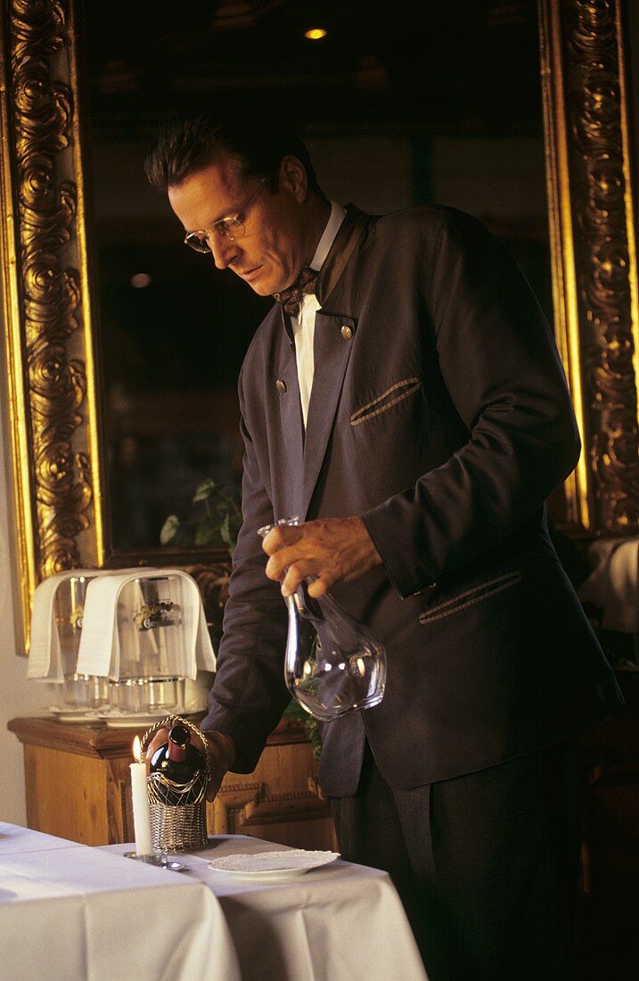 Wine waiter decanting wine in "Kurhausstüberl" (Waging am See)