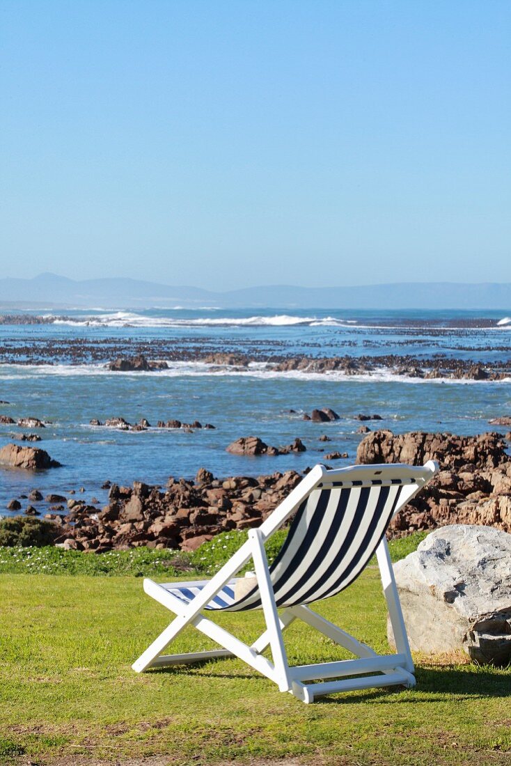 Deckchair on coast with sea view