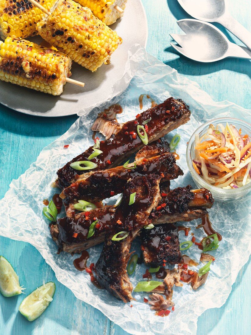 Smoked pork ribs with corn cobs and coleslaw