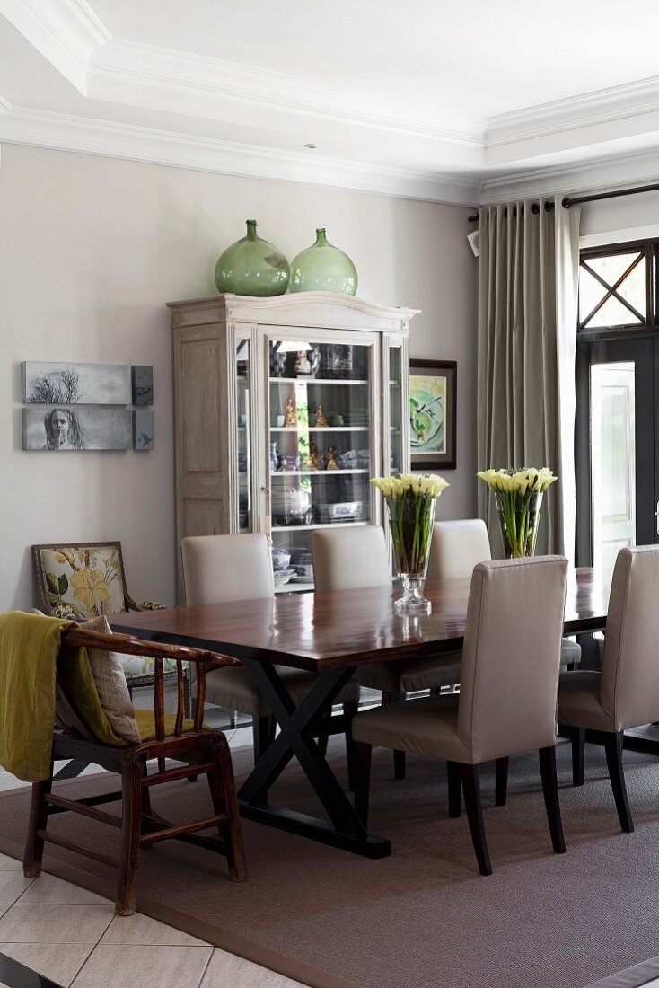 Upholstered chairs in elegant dining room in shades of grey