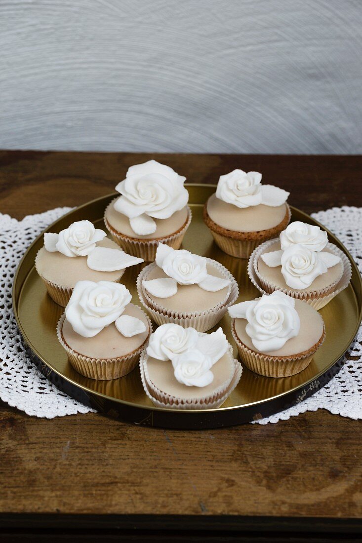 Cupcakes with white sugar roses