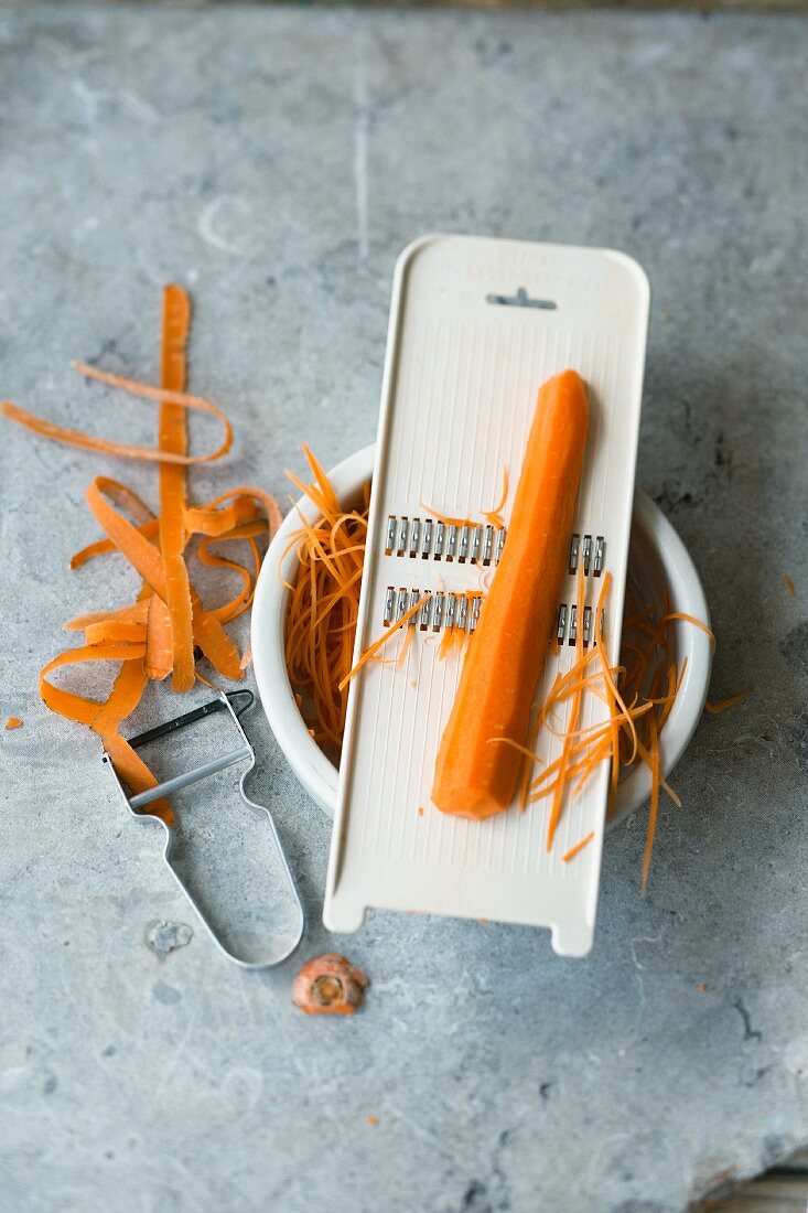 A carrot peeler and a grater