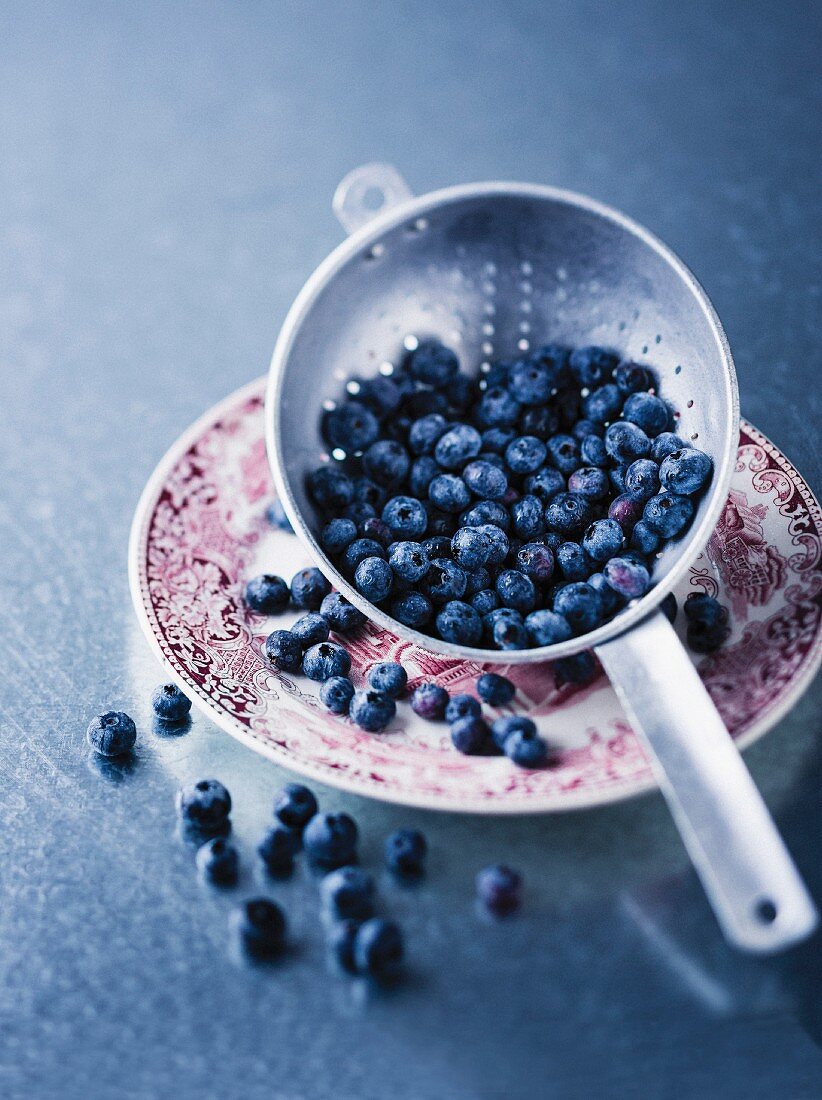 Fresh blueberries in colander