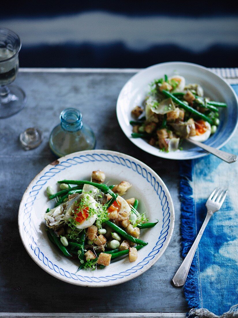 Artichoke salad with beans, egg and anchovy dressing