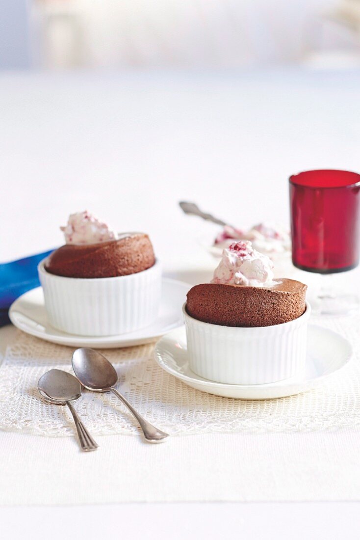 Chocolate souffles with raspberry cream