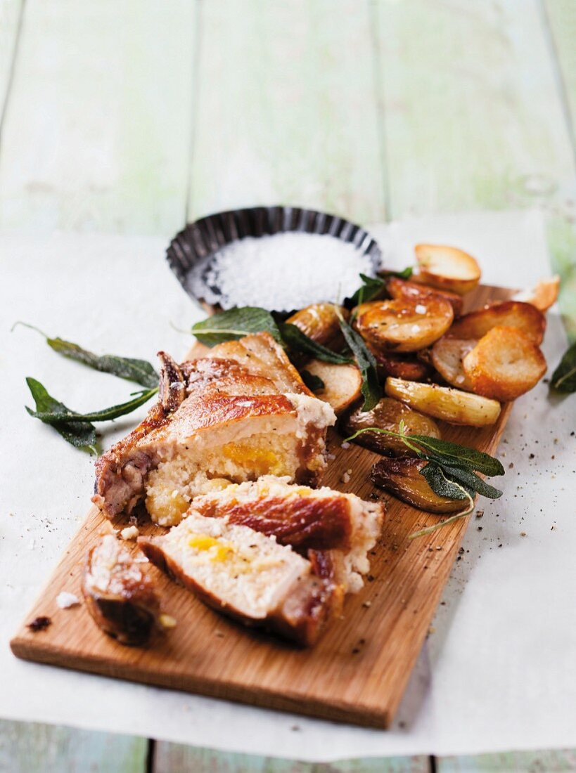 Pork chops with an apricot and almond filling and crispy sage potatoes