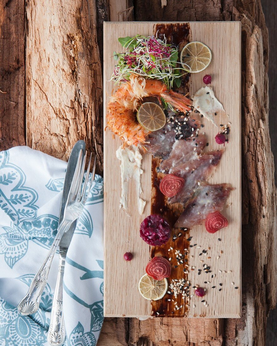 Fish carpaccio with beetroot and prawns