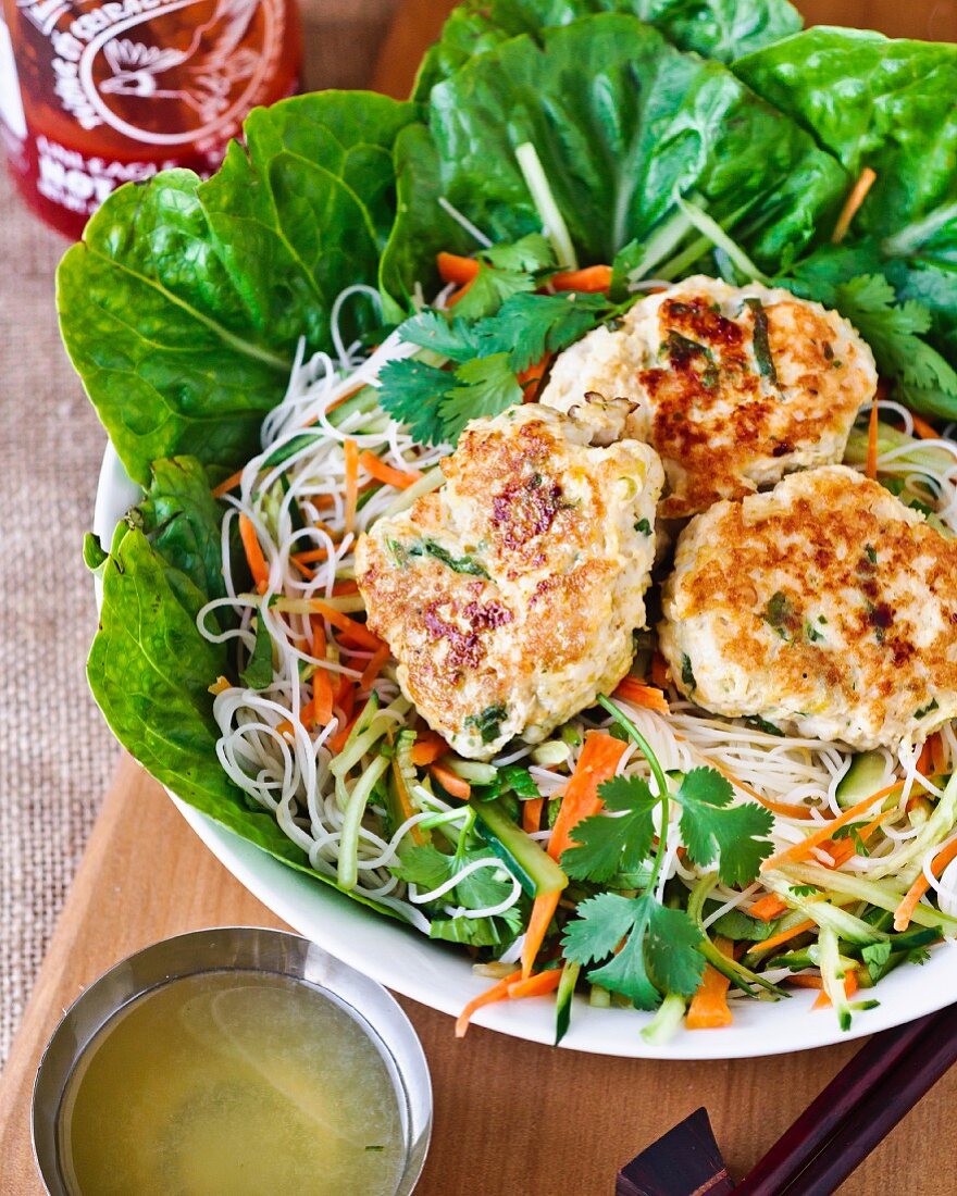 Fish cakes with pasta and salad (Thailand)