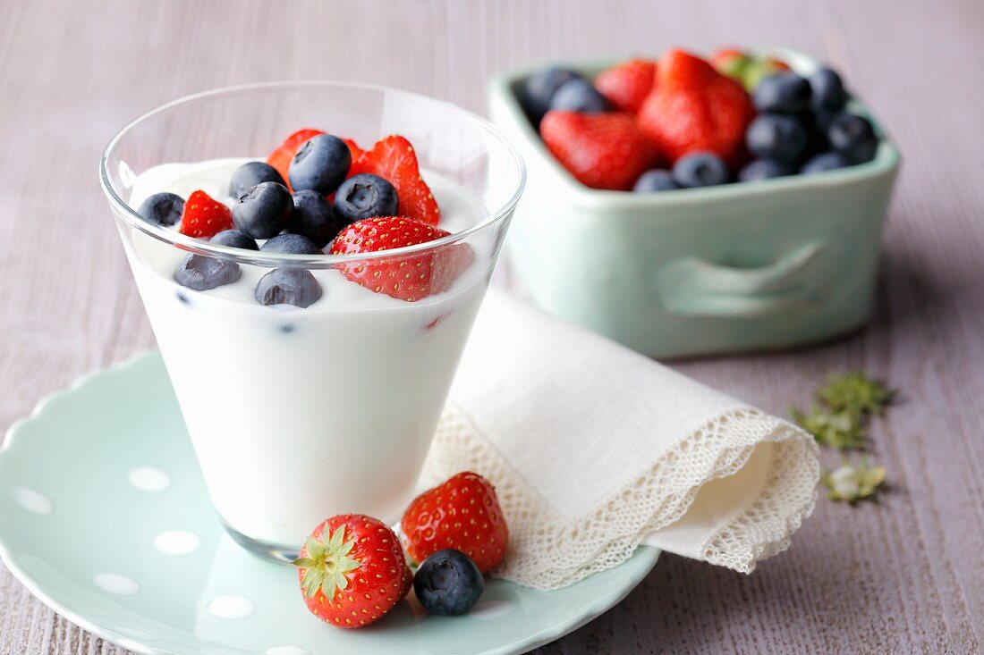Fresh yoghurt with strawberries and blueberries