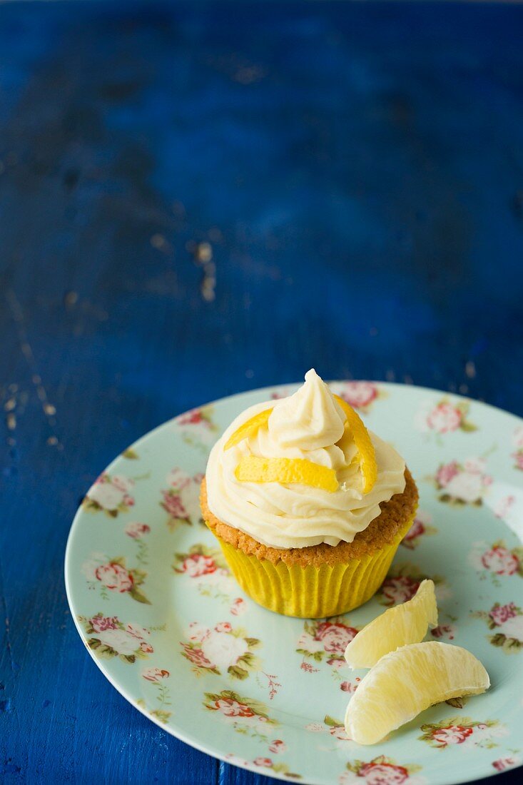 A cupcake with a lemon topping