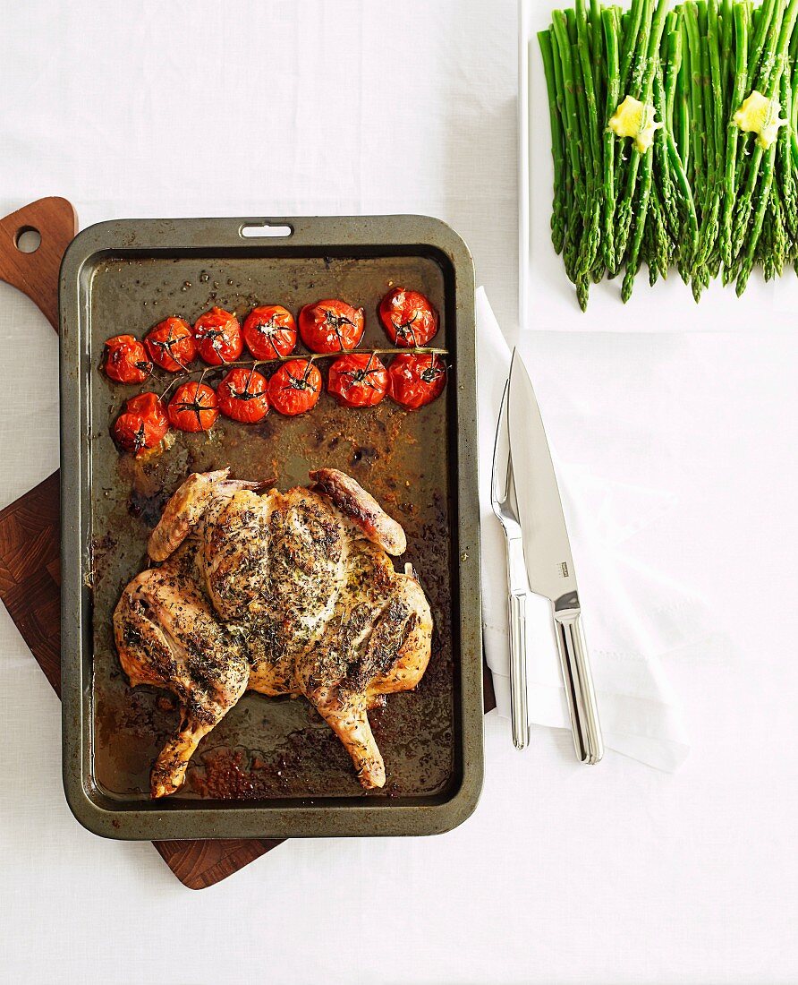 Herb chicken with asparagus and roasted tomatoes